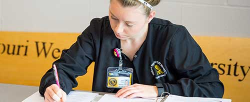 Student presenting at a conference