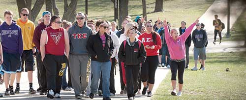 Students from various organizations walking across campus