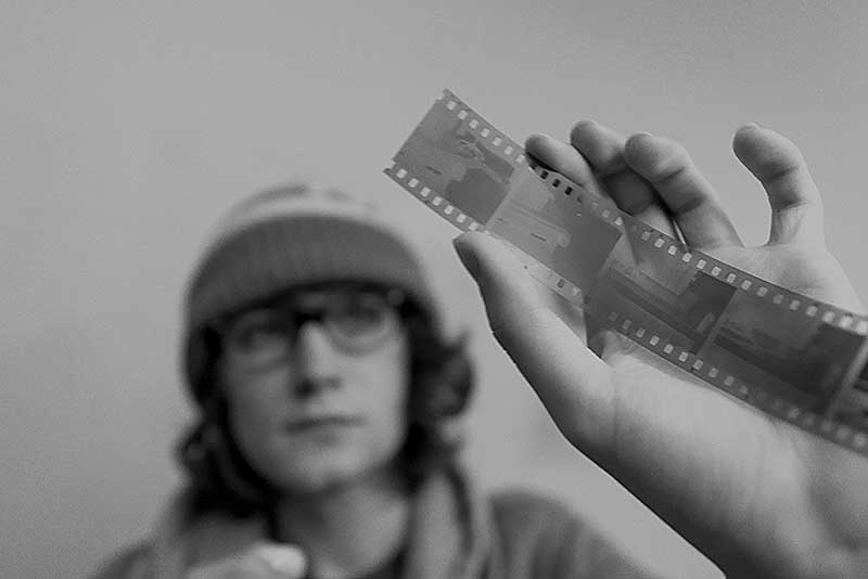 20181009ecMWSU_1132 MWSU art student holding a film negative in a darkroom