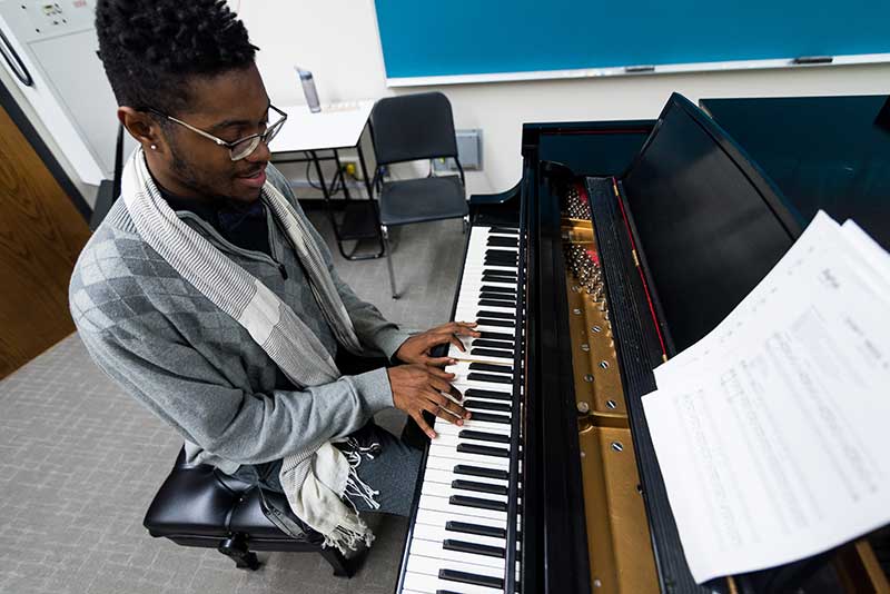 Missouri Western student practicing piano music