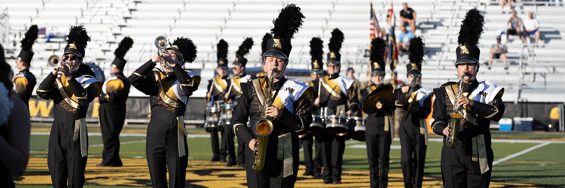 marching band on craig field at spratt stadium